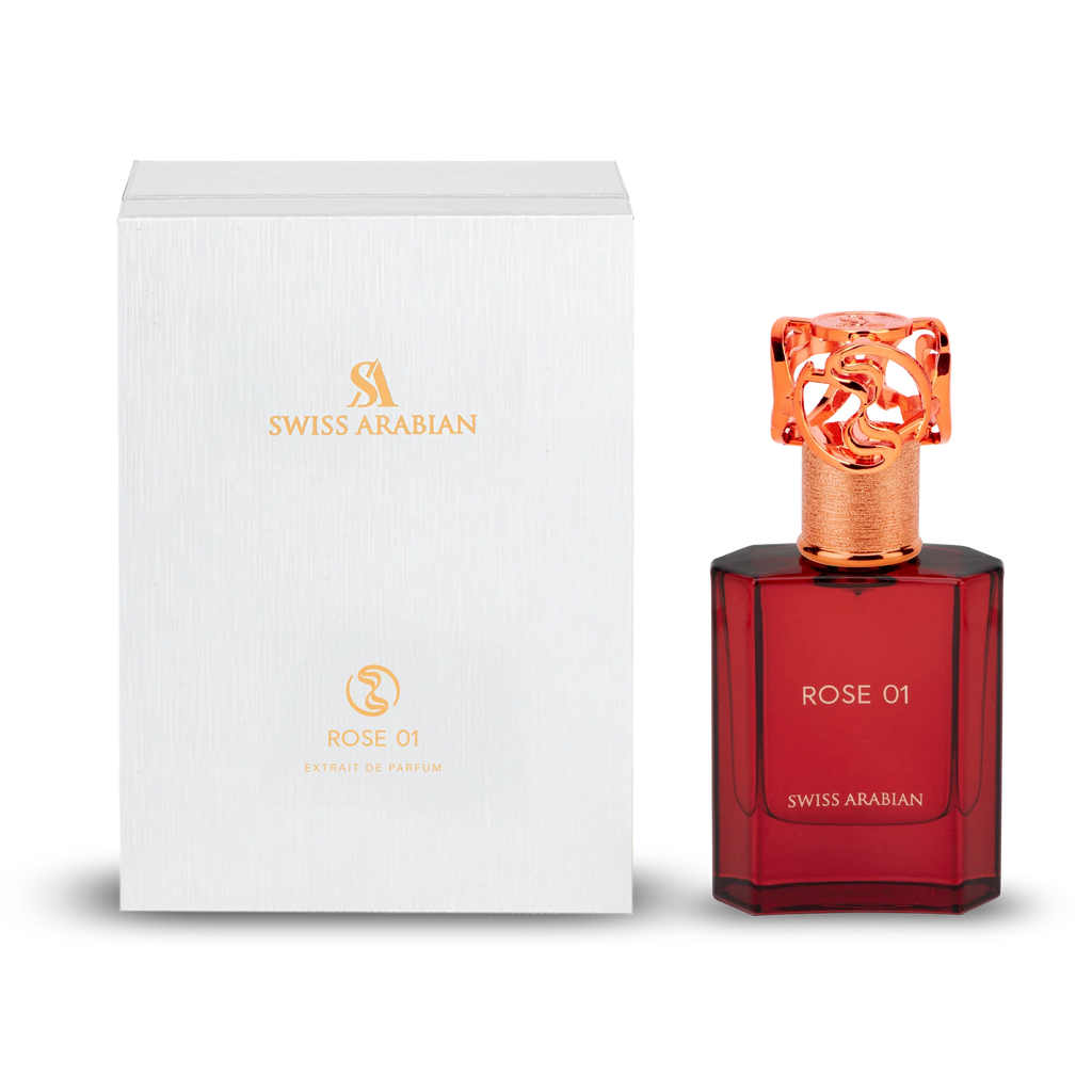 Swiss Arabian Rose 01 Extrait de Parfum mit rotem Glasflakon und roségoldenem, ornamentalem Verschluss neben weißer Originalverpackung.